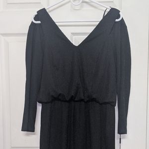 Peekaboo shoulder long sleeve CK jumpsuit. NWT